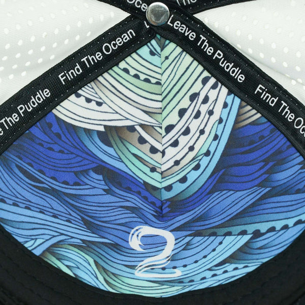 Interior design of Womens Trucker Hat Ponytail showing blue leaf pattern and motivational text on black trim