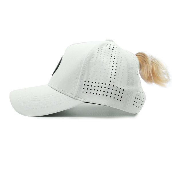 White Aoraki Womens Trucker Hat with high ponytail opening and breathable perforated panels