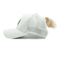 White Aoraki Womens Trucker Hat with high ponytail opening and breathable perforated panels