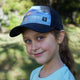 Youth Seas the Day Girls Trucker Hat with high ponytail opening, water-resistant, breathable for girls ages 4-10