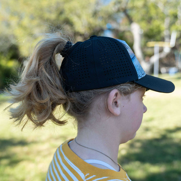Girls Trucker Hat with high ponytail opening for girls, black, breathable and water-resistant, designed for ages 4-10, Seas the Day theme