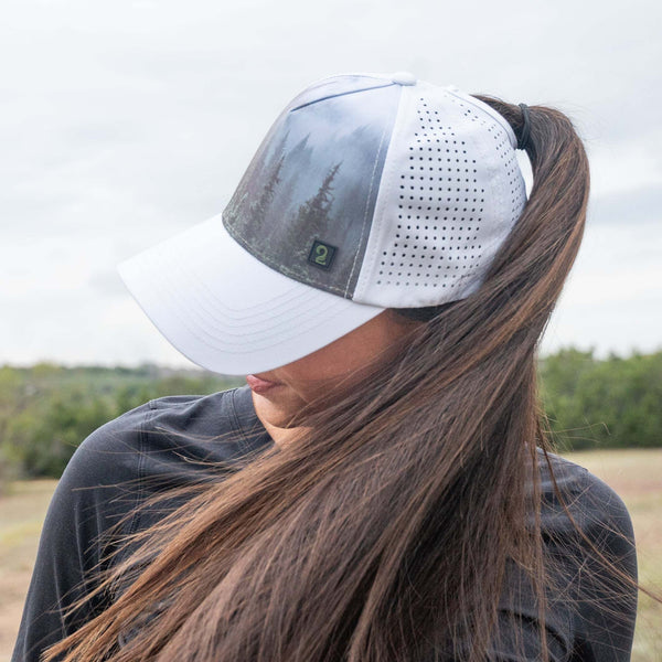 High ponytail womens trucker hat with water-resistant panels and breathable design for outdoor adventures