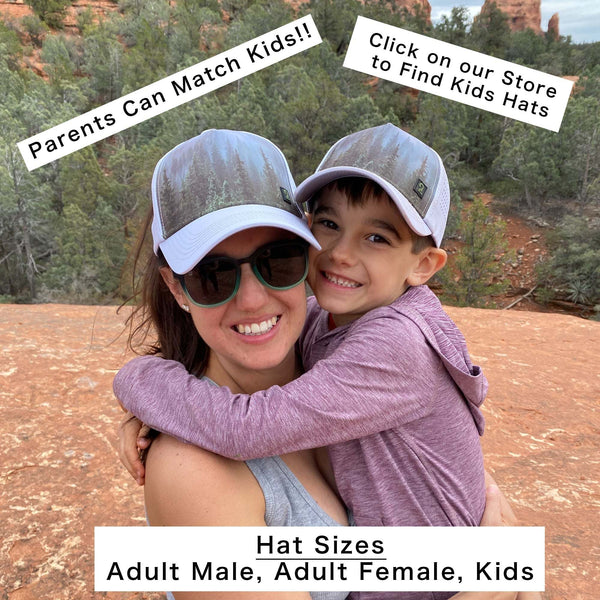Woman and child wearing matching high ponytail womens trucker hats outdoors in a rocky natural setting