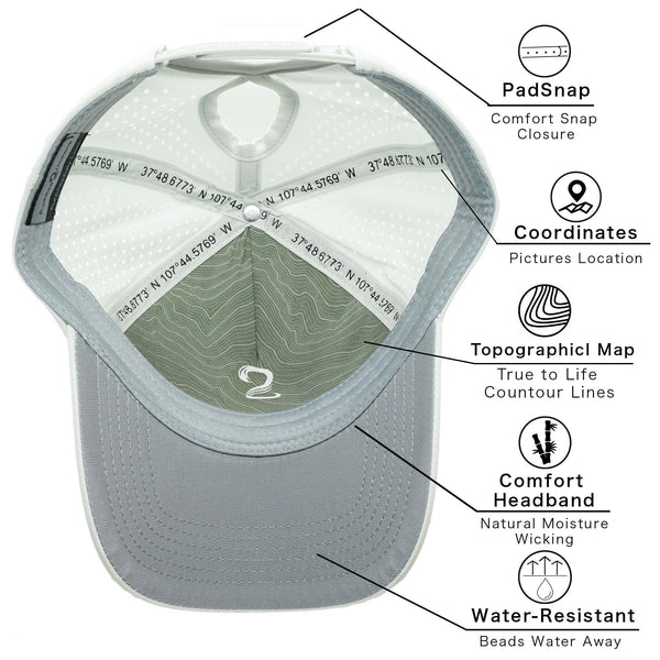 Interior view of high ponytail womens female trucker hat showing PadSnap comfort snap closure, location coordinates, topographical map design, natural moisture-wicking comfort headband, and water-resistant material features