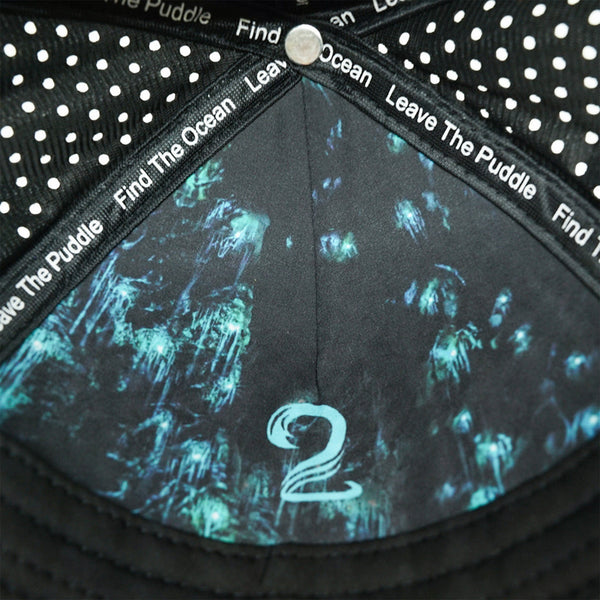 Interior view of female trucker ponytail hat with water-resistant, breathable material and motivational text on inner band