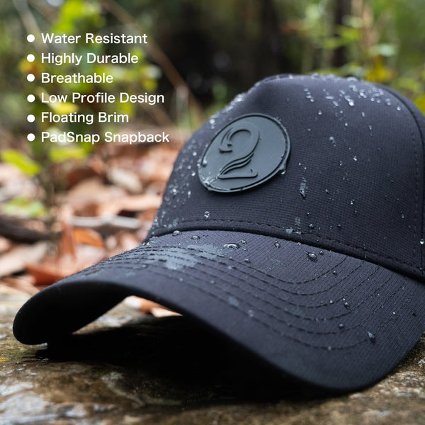 Black female trucker ponytail hat with water-resistant, breathable, and durable design featuring PadSnap snapback and low profile floating brim