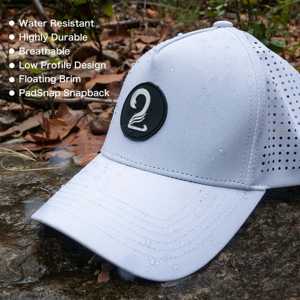 White Aoraki ponytail Womens Trucker Hat with water-resistant breathable fabric and PadSnap snapback design