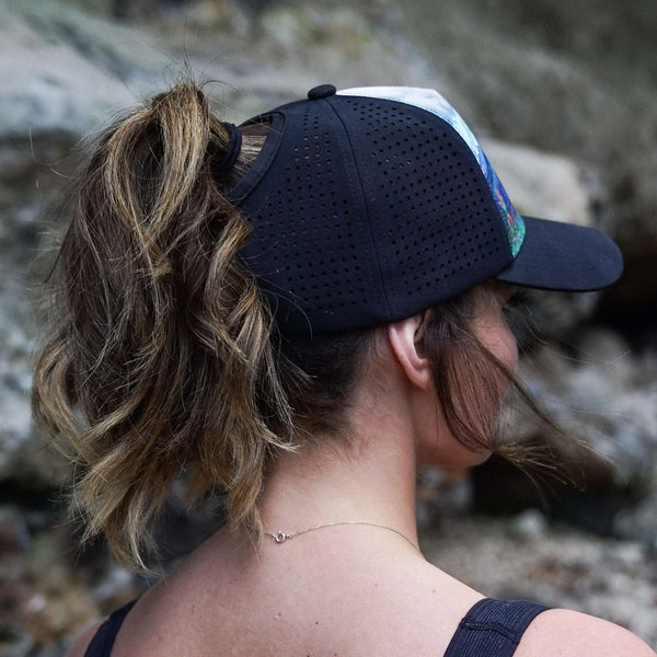 Female trucker hat with high ponytail opening, breathable and water-resistant for outdoor adventures